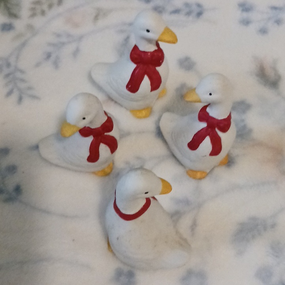 Four Charming Goose Figurines with Red Accents